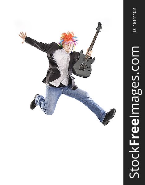 Young guy jumping with guitar