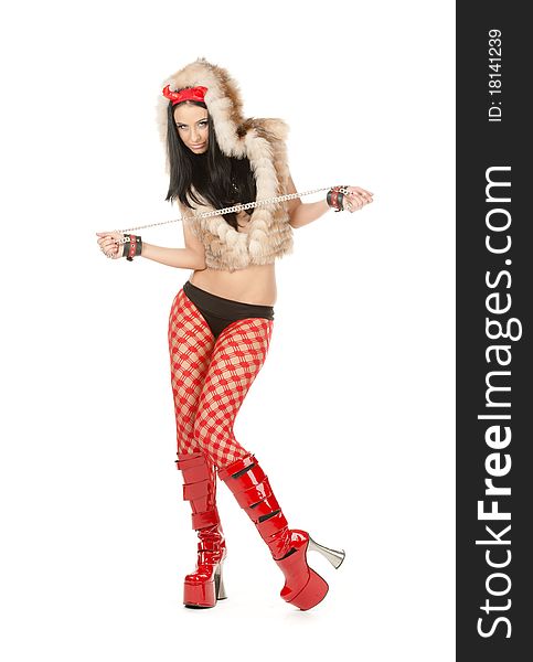 Girl devil posing in red boots on white