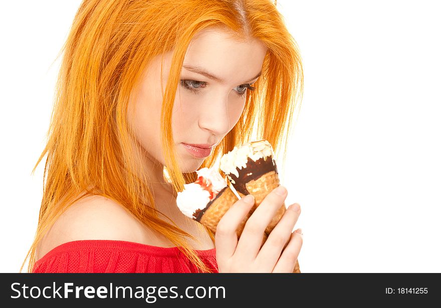 Redhead girl holding ice cream on white