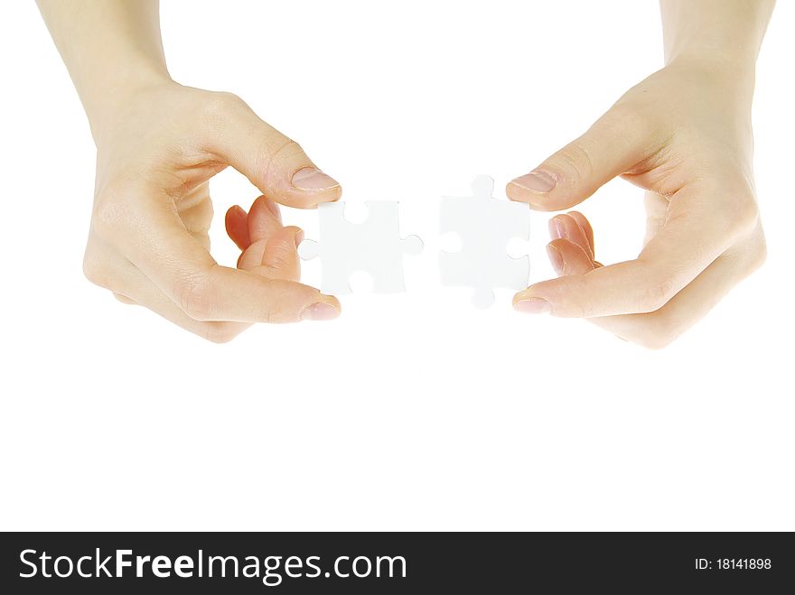 Puzzle in hands isolated on white background