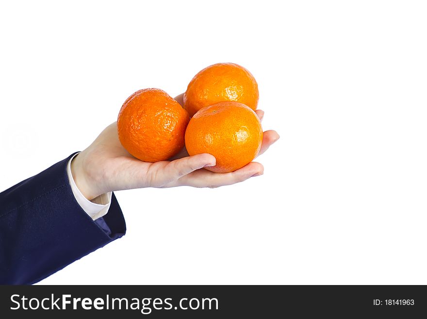 Female hand with oranges background