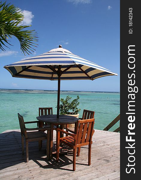 Caribbean Beach Table Under A Palm Tree