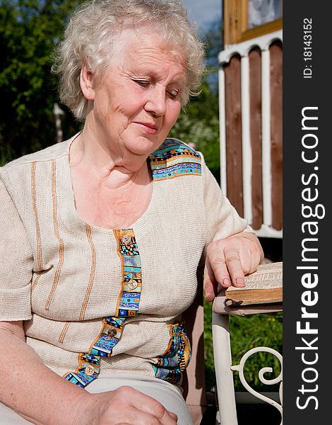 Older woman reading a book