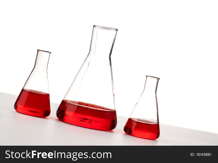 Three flasks with red liquid. Three flasks with red liquid.