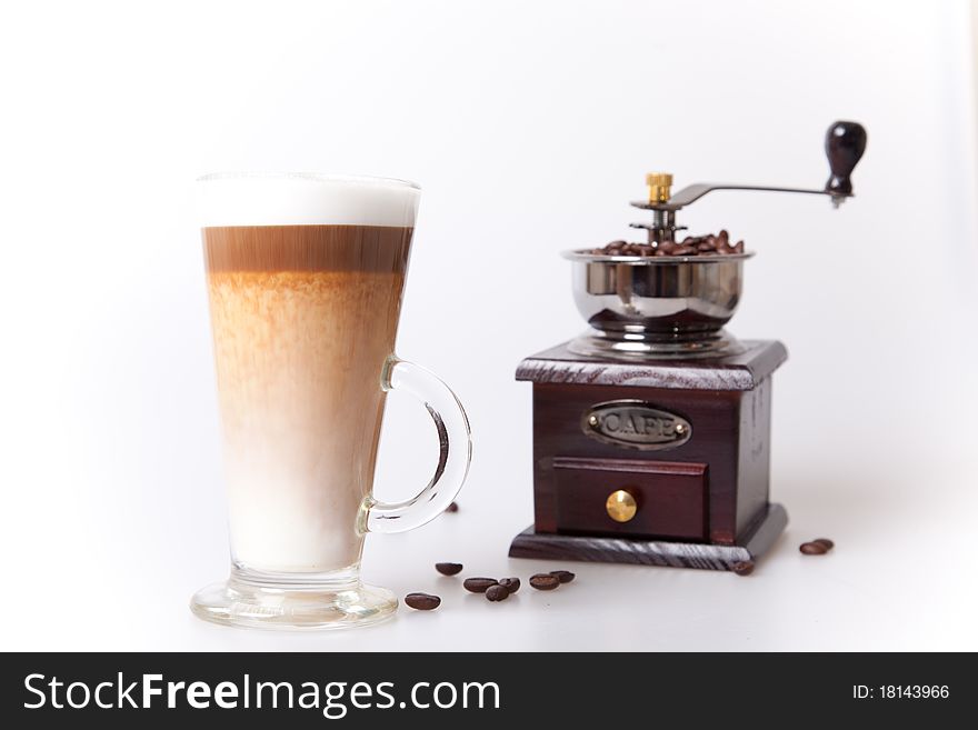 Coffee cup with coffee maker and beans in white background