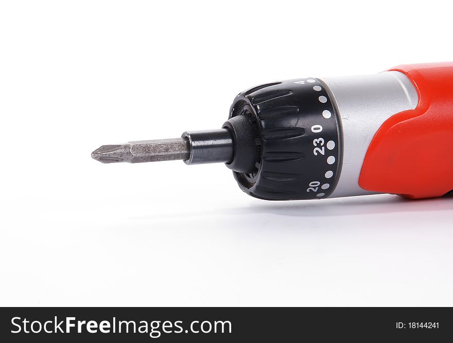 The head of an electric screwdriver with a nozzle on a white background