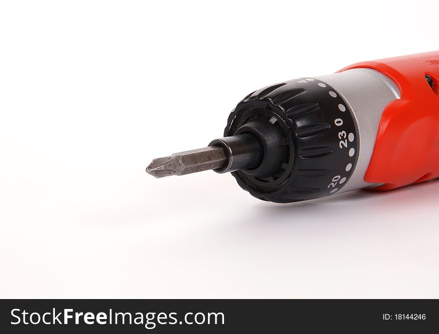 The head of an electric screwdriver with a nozzle on a white background