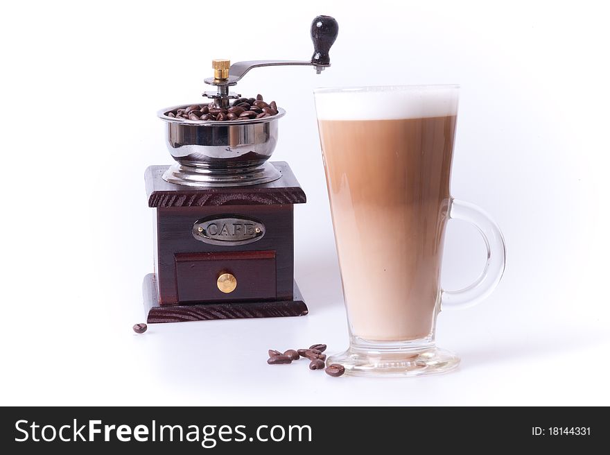Coffee cup with coffee maker and beans in white background