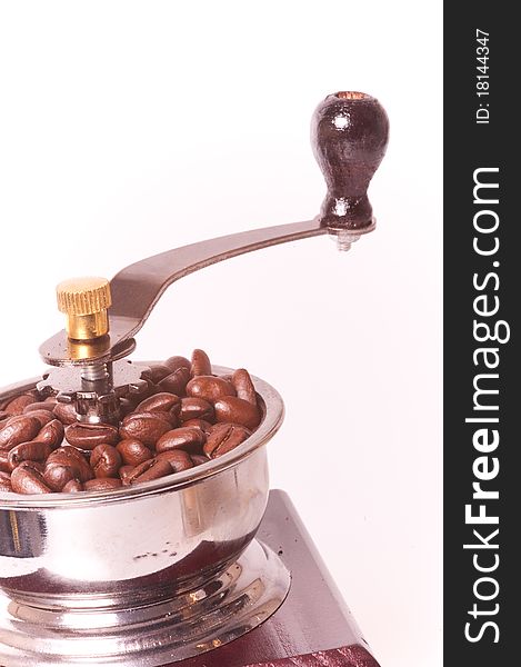 Coffee maker with coffee beans in white background