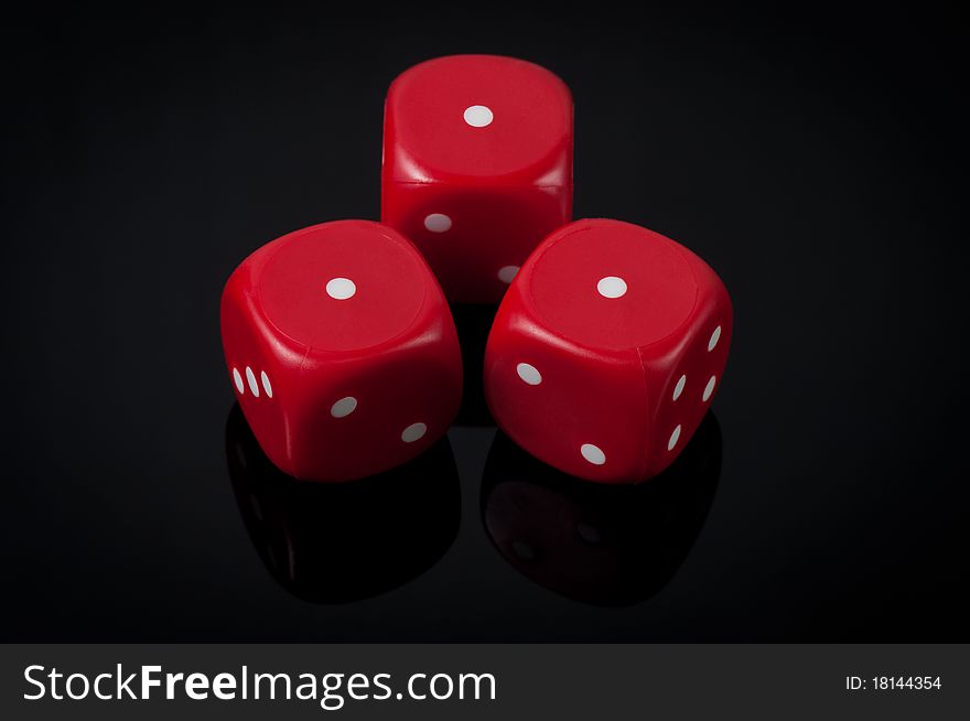 Closeup of three red dice on green background. Closeup of three red dice on green background