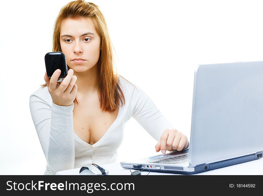 Young adult red haired business lady over white frustrated with her computer. Young adult red haired business lady over white frustrated with her computer