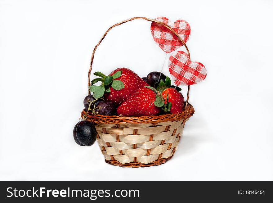 Fruit and berries in a basket for a gift