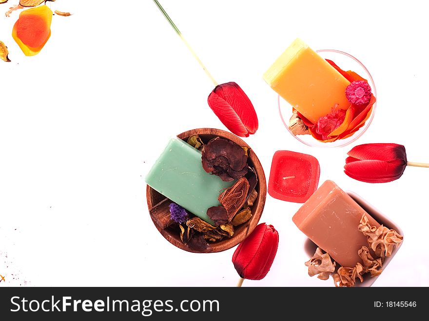 Spa concept with flowers, soapand candle isolated on white