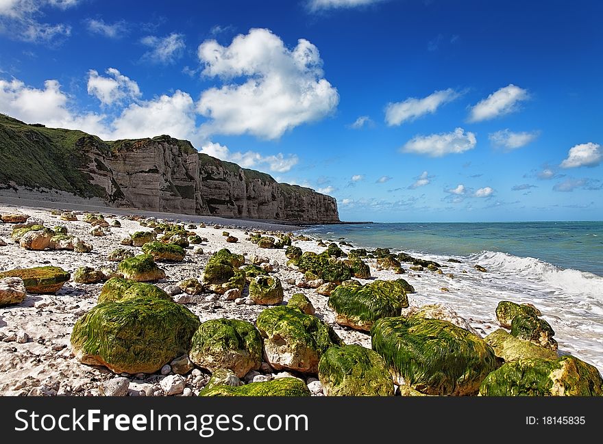 Image of the rocky beach from Le Tileul in the Upper Normandy in the North of France. Image of the rocky beach from Le Tileul in the Upper Normandy in the North of France.