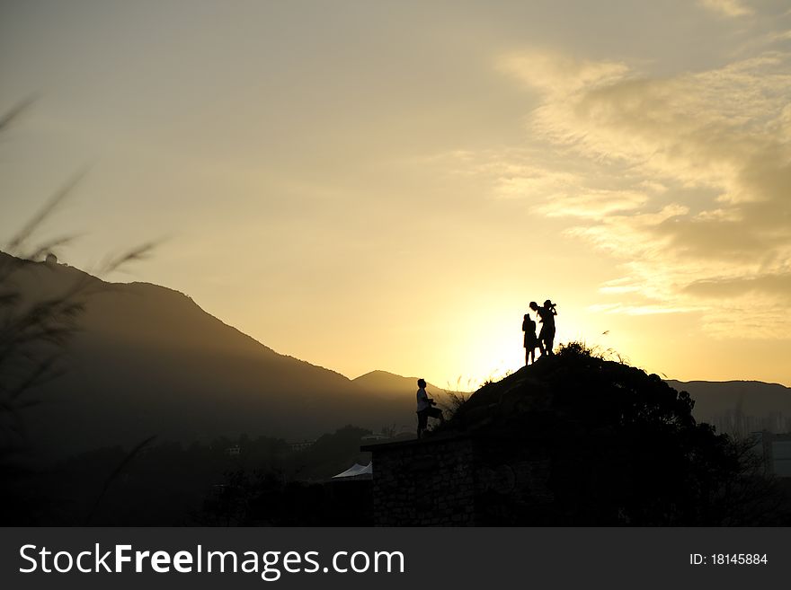 Silhouette of people in sunset light