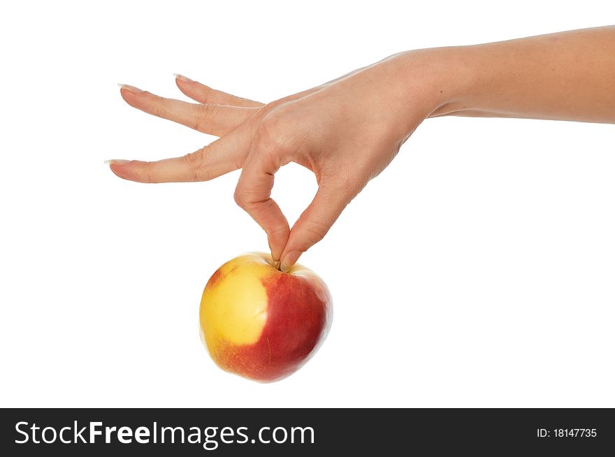 Woman holding in the hand one fresh yellow with red-edged apple