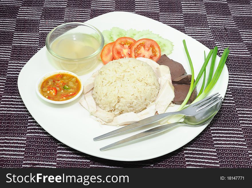 Hainanese Chicken Rice or soup.
