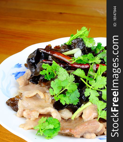 Chinese dish with pork, fungus and parsley