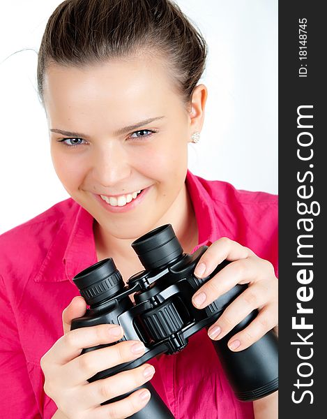 Surprised girl with binoculars on white. Surprised girl with binoculars on white