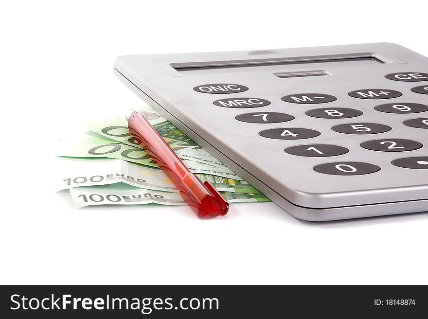 A large calculator with a red pen and the bills of a hundred euros on a white background