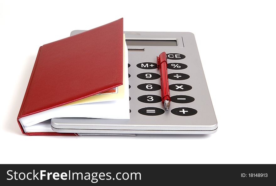 Great calculator and red notebook for reference daily notes with a pen on a white background