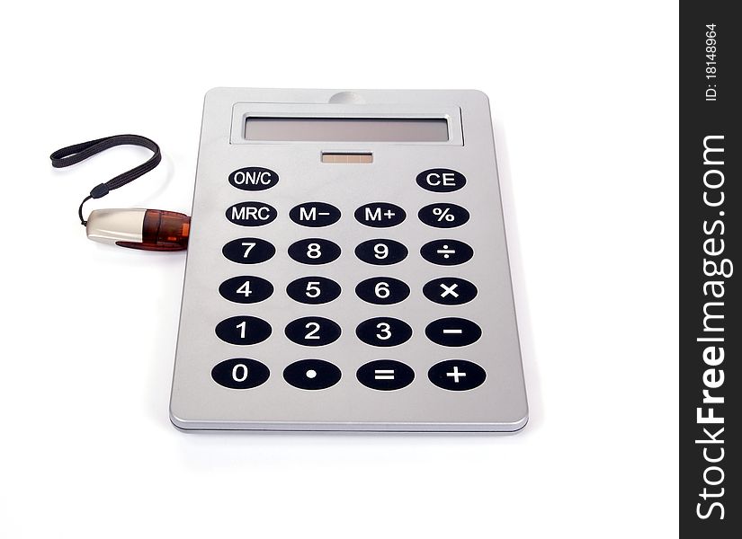 A large calculator with USB flash drive on white background