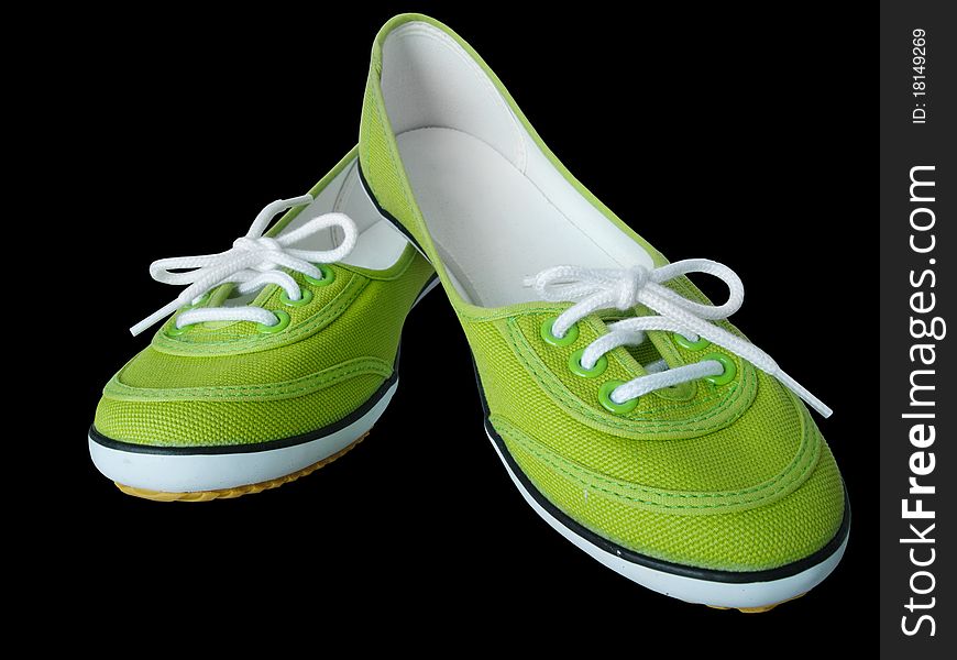 Light green fabric shoes on Black background