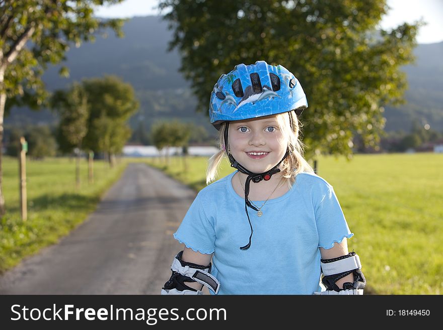 Young Beautiul Blond Girl Inline-skating Outdoor