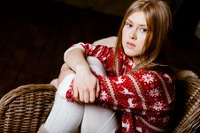 Woman Sits In A Chair Wearing A Sweater With The R Royalty Free Stock Photo