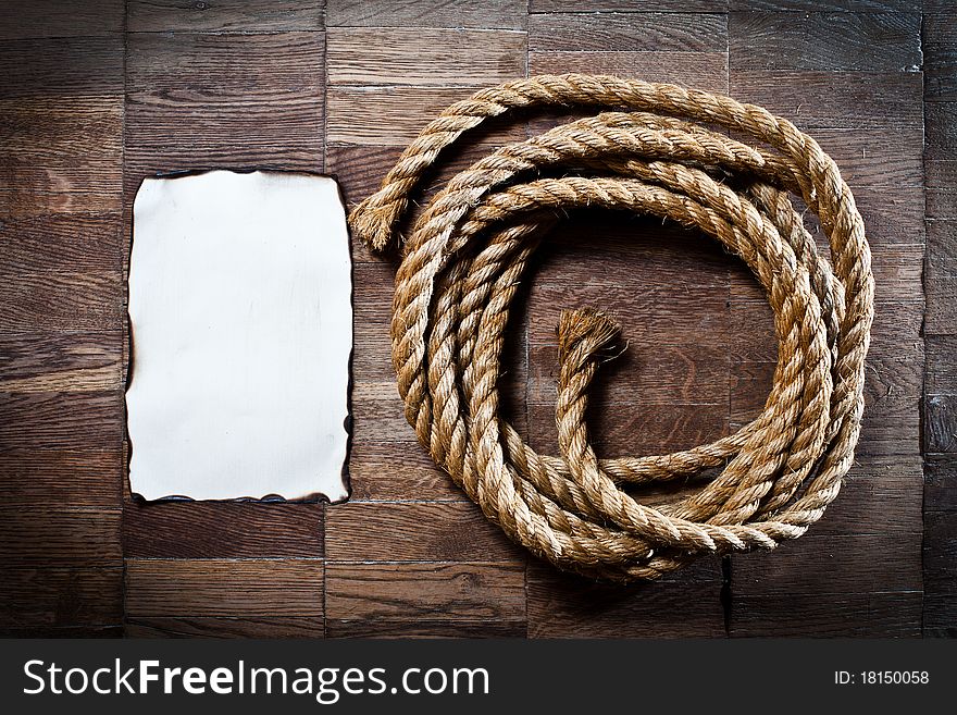 Old texture of wooden boards with ship rope.