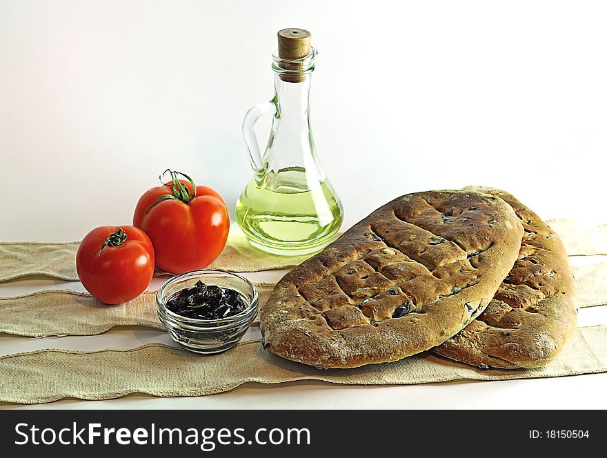 Isolated image of homemade fugas bread with olives, boul with olive and stylized with tomato. Isolated image of homemade fugas bread with olives, boul with olive and stylized with tomato