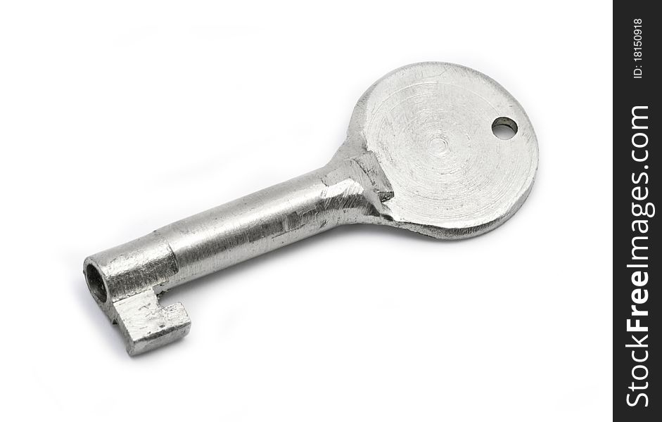 One old steel key isolated on white