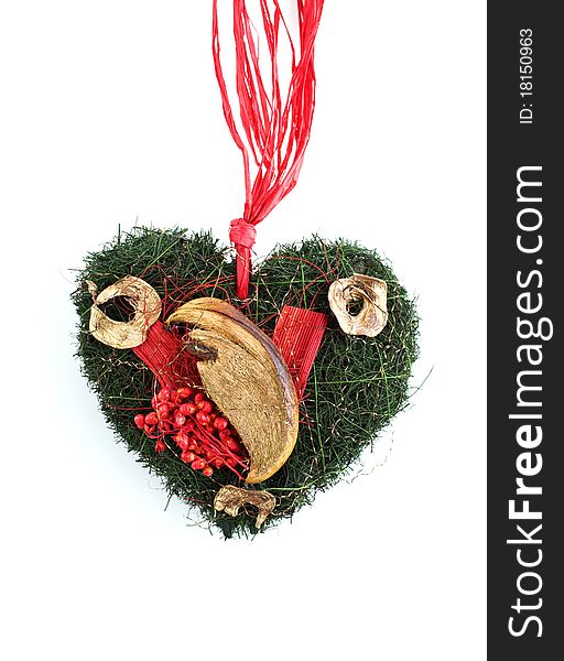 Christmas decoration with dried fruits and berries in heart shape