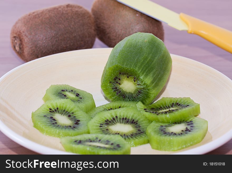 A delicious kiwi to cut and eating. A delicious kiwi to cut and eating