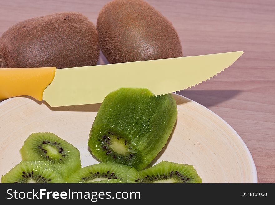 A delicious kiwi to cut and eating. A delicious kiwi to cut and eating