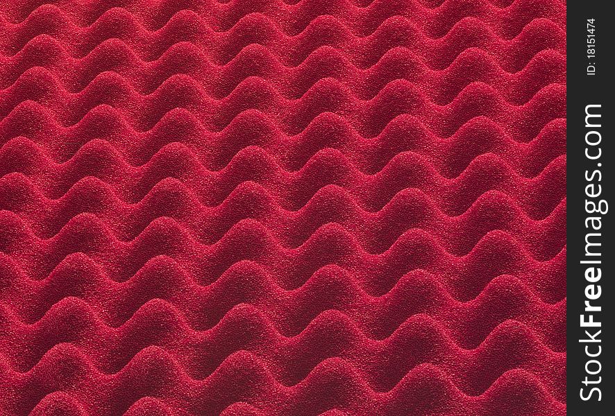 Red plastic insulating material, forming a texture macro photography. Red plastic insulating material, forming a texture macro photography