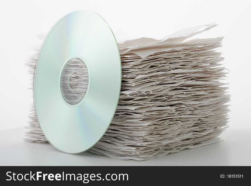 CD leaning against a stack of paper