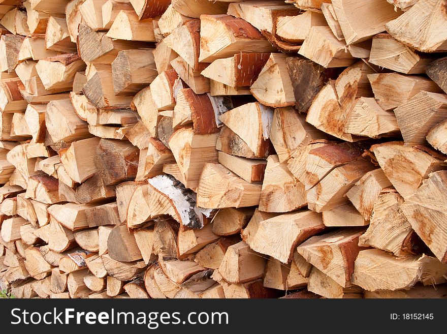 A stack of birch wood for heating stoves and fireplaces