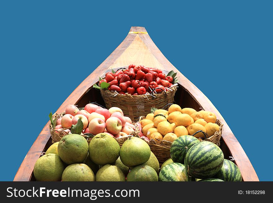 Various fruits on the boat isolated on blue. Various fruits on the boat isolated on blue