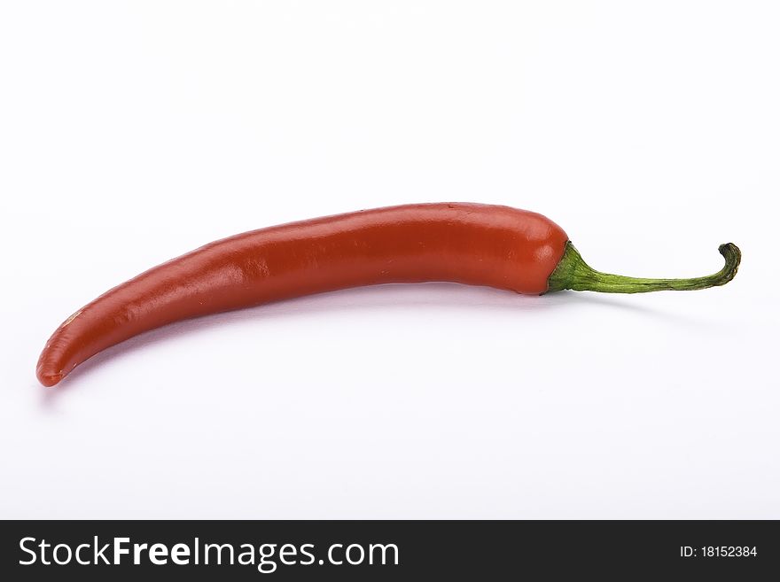 Hot, tasty, red pepper on white background. Hot, tasty, red pepper on white background