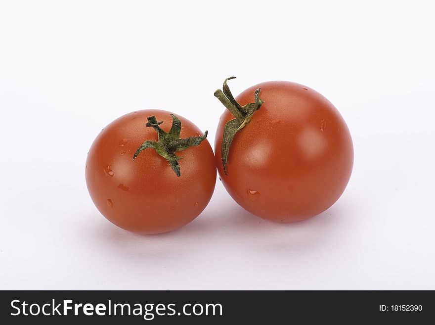 Fresh, young, tomatoes on white background. Fresh, young, tomatoes on white background