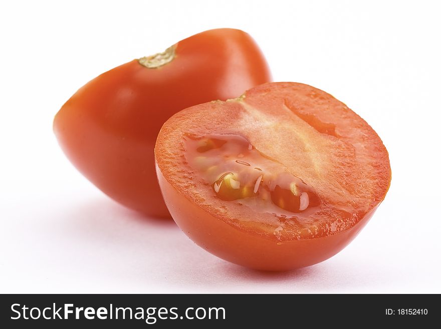 Fresh and red tomato, cut on white background. Fresh and red tomato, cut on white background