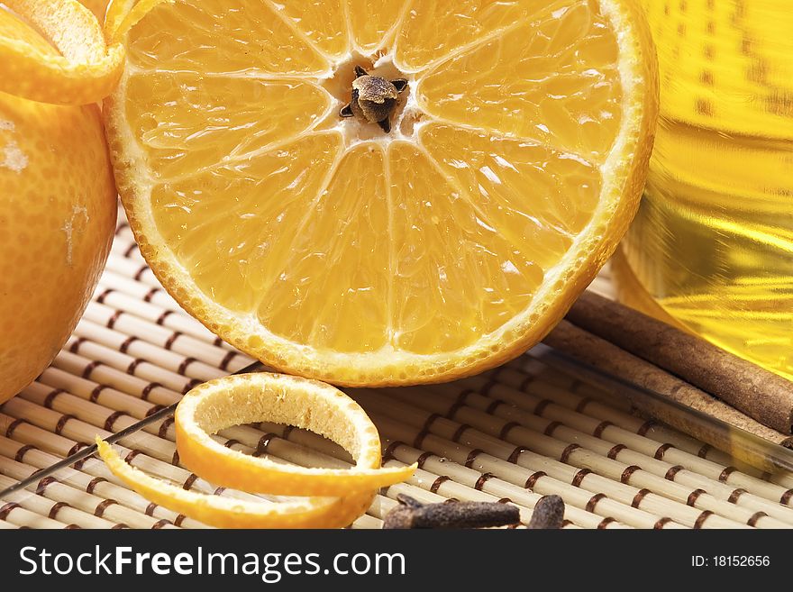 Close up halved orange with rose-apple