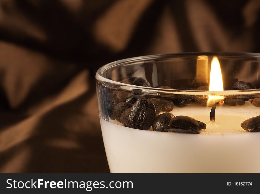 Close up of burning coffee candle