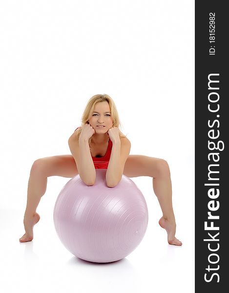 Pretty fitness woman exercise with pilates ball