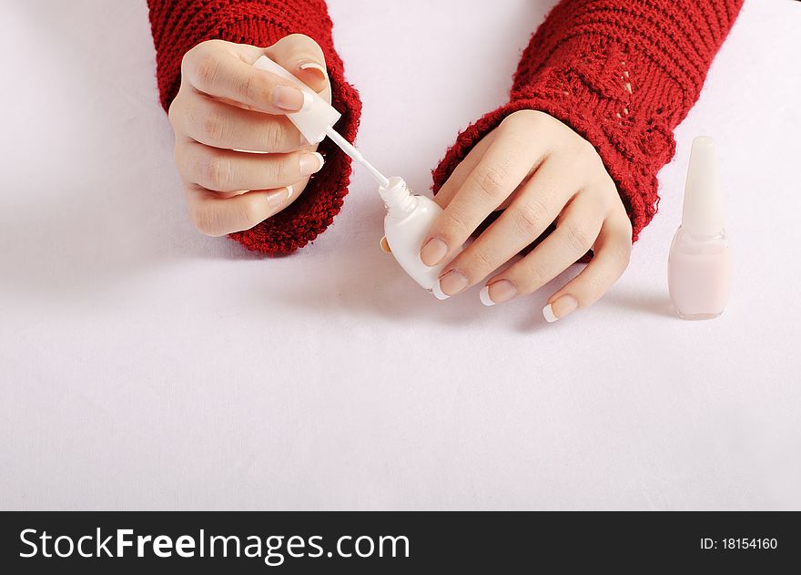 Woman holding white nail polish. Woman holding white nail polish