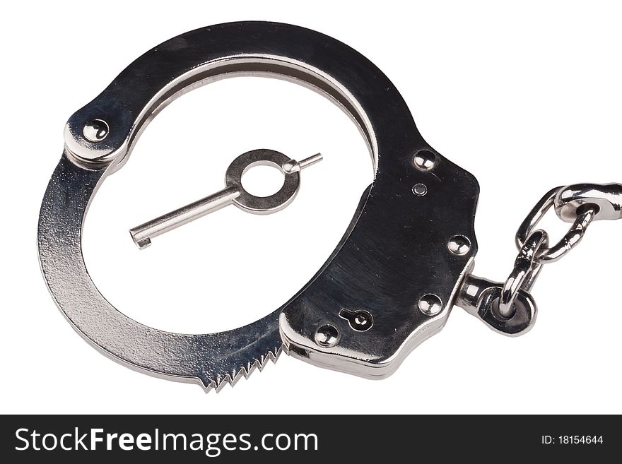 Closed iron handcuffs on a white background.