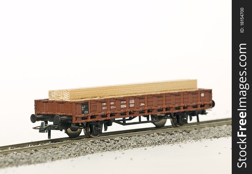 A platform wagon on rail isolated by white background