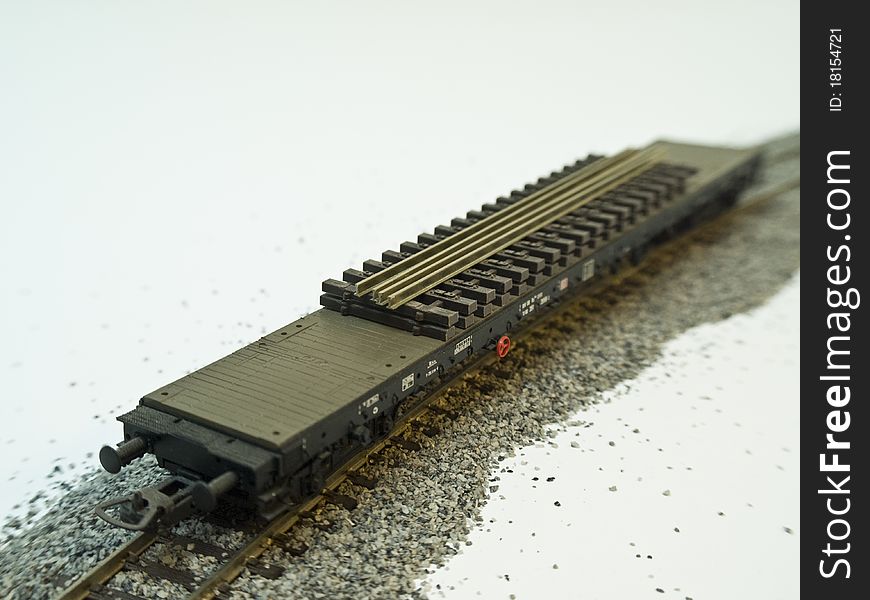 A platform wagon on rail isolated by white background