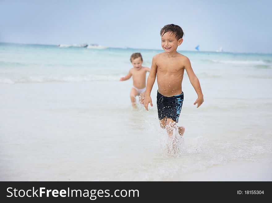 Children Playing On Beach